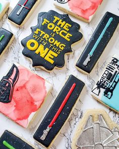 decorated cookies with star wars characters and words on them, including the force is strong with this one