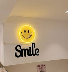 the smile sign is on the wall above the escalator in the children's room