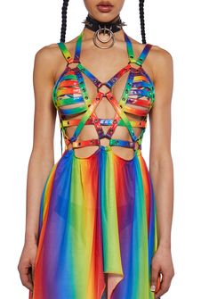 This harness dress has a vegan leather strapped chest construction with grommets and adjustable straps with a rainbow design, o-ring hardware, snap button closures, and an attached sheer mesh handkerchief skirt with a rainbow design. Rainbowcore Fashion, Vtuber Reference, Pride Fits, Rave Fits, Handkerchief Skirt, Rave Gear, Harness Dress, Rave Fashion, Handkerchief Dress