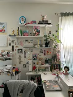 a cluttered room with many items on the wall and shelves above it, along with other things