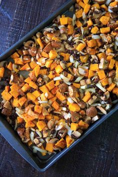 a casserole dish filled with sweet potatoes and nuts