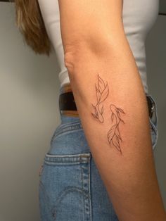 a woman with a tattoo on her arm