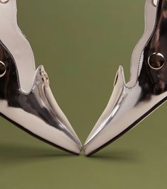 Titled for activist and green campaigner Nakabuye Hilda, who has moved the world with her straightforward, yet compelling climate-change campaign, our Nakabuye slingback makes a simple, but strong statement. It's vegan upper speaks to a considered ethos, while its metal grommet detailing demonstrates a unique point of view. Mixed Metals, Point Of View, Metallic Silver, The World, Green, Silver, Design