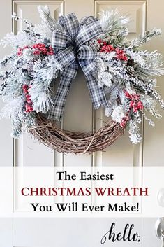 a christmas wreath hanging on a door with the words beautiful snowy christmas wreath diy