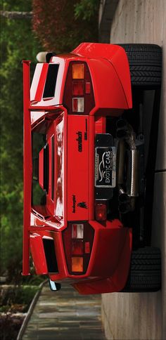 the rear end of a red sports car