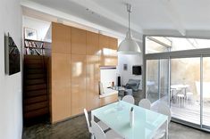 a dining room and kitchen area with sliding glass doors