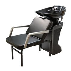 a hair salon chair with a sink on it's back end and armrests