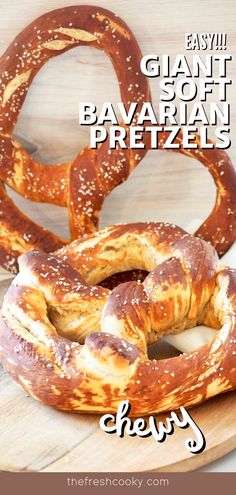 two giant soft pretzels sitting on top of a cutting board with the words easy giant soft bavaran pretzels