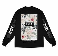 a black long - sleeved t - shirt with white flowers and the words, hga created to flourish