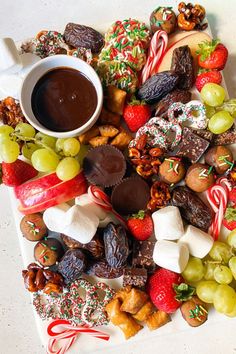 a holiday dessert charcuterie board with chocolate and candy