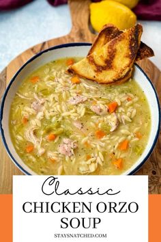 chicken orzo soup in a bowl with bread on the side