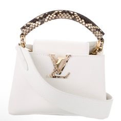 Lv Top Handle 2020 Collection By Nicolas Ghesquiere White Leather Graphic Print Gold -Tone Hardware M Handle & Shoulder Strap Leather Lining And Single Interior Pocket Comes With Dust Bag Est. Measurements Shoulder Strap: 21.75” Handle Drop: 1.5” Height: 5” Width: 7.75” Depth: 3” Faint Scuffs At Exterior, Minor Scratches At Hardware. Excellent Condition Louis Vuitton 2020, Capucines Mini, Bags Louis Vuitton, Nicolas Ghesquiere, Louis Vuitton Bags, White Leather, Mini Bag, Louis Vuitton Bag, Graphic Prints