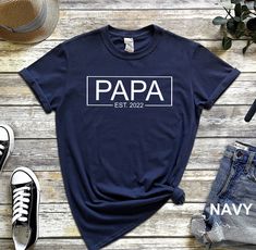 an american t - shirt with the word america on it next to two pairs of jeans