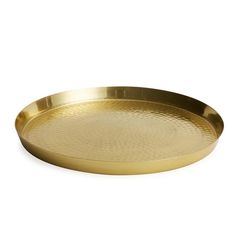 a brass tray on a white background with no one in it or someone else to the side