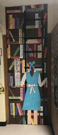 a door decorated to look like a library with bookshelves and girl in blue dress