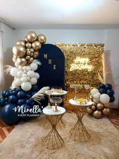 a party setup with balloons, cake and drinks on the table for a new years eve celebration