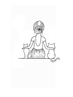 a woman sitting on top of a table with two cats