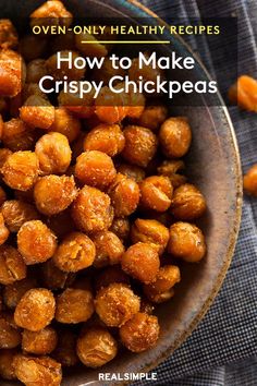 a bowl filled with crispy chickpeas on top of a table