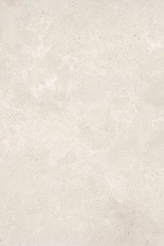 a white marble textured wallpaper with no pattern