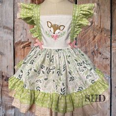 This Sweet Faline inspired deer dress is perfect for that special Birthday party! The bodice is solid white and includes Faline Doe embroidery, is featured in the double flutter sleeves as well as along the hemline.  The back has a sweet bow and an elastic back for that full adjustability. 9-12 months- 26-27.5inch, 15-19LBS 18 months- 28-29.5inch, 19-23LBS 2T - 30-31.5inch, 23-27LBS 3T - 32-34 inch, 27-30LBS 4T - 35-37inch, 30-34LBs 5T - 37-40inch, 34-38LBS 6 Yr. - 42inch, 37-41LBS 8Yr, - 45inch, 40-45LBS 10Yr, - 49inch, 60LBS 12Yr, - 52inch, 66LBS 14Yr, - 55inch, 72LBS *Dress is designed to fall mid-level on the thigh. * You can add dress bloomers and hair bow for an extra fee.  your order will ship out in 5 to 7 business days and take an additional 3-5 days to arrive, if you need it soon Fawn Dress, Fawn Clothes, Baby Deer Tutu Costume, Robe Dressed Deer And Doe, Bambi Dress, Deer Dress, Deer Girl, Big Girl Dresses, Theme Dress