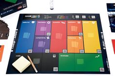 the board game is being played with several different colors and shapes, including one for each player