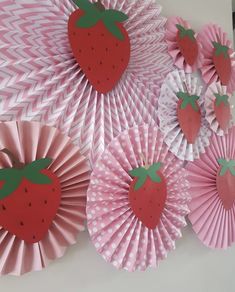 some paper strawberries are sitting on top of each other