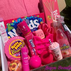 a pink box filled with lots of different items