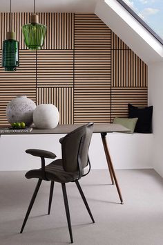 a room with a table, chairs and vases on top of the table in front of an open skylight