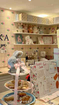 there are many items on the shelves in this store that is decorated with flowers and teddy bears