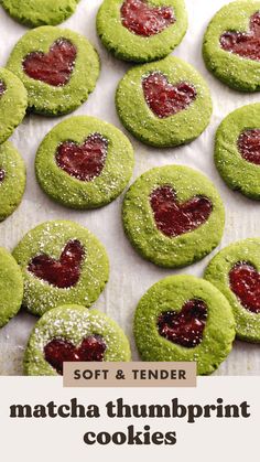 soft and tender matcha thumbprint cookies with raspberry jam in the middle