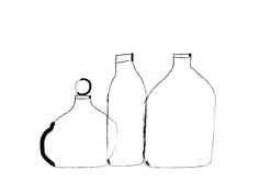 three empty bottles are shown in black and white