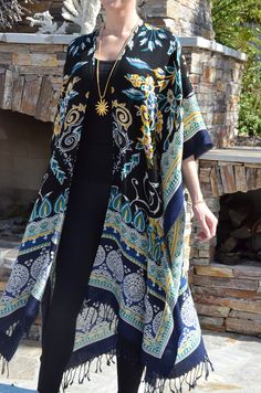 This magnificent wool challis kimono/duster, is a garment to wear year round with dresses, pants, leggings, jeans or skirts.  Lightweight pure wool fabric is appropriate to wear summer or winter.  Perfect for cool, summer evenings.  Great for travel and packing as there is little wrinkling.  Can also be made as a caftan. One size.  It measures 40 inches wide, outside edge to outside edge when CLOSED.  The length is 45 inches,  Fits many sizes small to X-large.  Dry clean. Duster Kimono, Navy Blue Print, Kimono Duster, Womens Coats, Wool Wrap, Womens Kimono, Cool Summer, Summer Evening, Dresses Pants