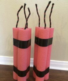 two pink vases with black ribbons on them