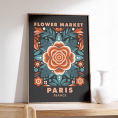 a framed flower market poster on a wall