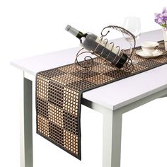 a table with a wine bottle and glasses on it