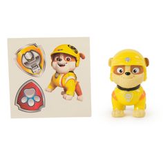 a small toy with a fireman on it next to a card and sticker