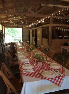 an image of a dining room set up for a party with red and white checkered tablecloths