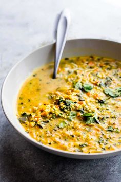 a white bowl filled with soup on top of a table