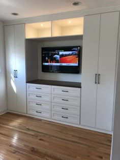 a flat screen tv mounted to the side of a wall