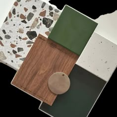 the flooring samples are all different colors and shapes, including brown, green, white, and black