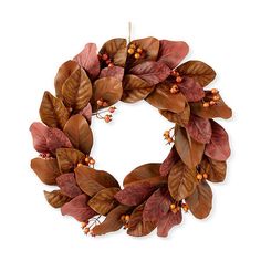 a wreath with leaves and berries on it