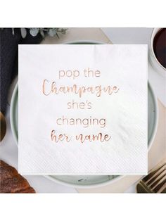 a white napkin with the words pop the champagne she's changing her name on it