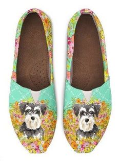 a pair of women's shoes with a schnauzer on the front