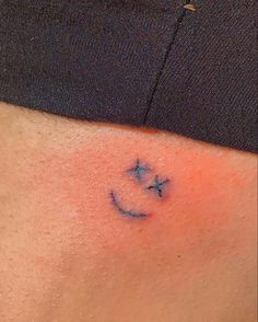 a person with a small tattoo on their stomach