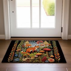 a door mat with an image of animals and plants on it in front of a window