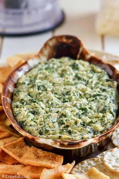 spinach dip with tortilla chips on the side