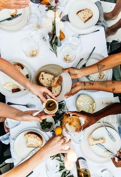 a group of people sitting around a dinner table