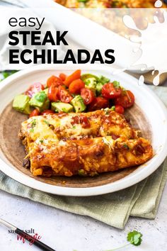 easy steak echiadas on a plate with tomatoes and cucumbers