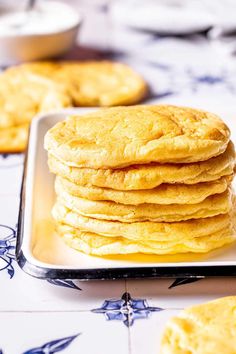 a stack of pancakes sitting on top of a metal pan