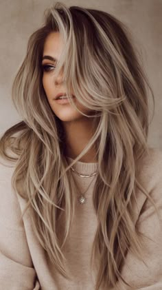 Achieve effortless volume with textured long layers! These layers add subtle texture and dimension, giving your hair a fuller, more voluminous look without the extra effort. #EffortlessVolume #TexturedHair #LongLayers #FullAndFabulous Long Womens Hairstyles, Long Layers To Add Volume, Long Layers Hair Styles, Long Hair 2025 Trends Women, Long Dark Blonde Hair With Bangs, Hair Color And Cut 2025, Long Hairstyles 2025, Long Hair Cuts With Layers Face Frame, Long Volume Haircut